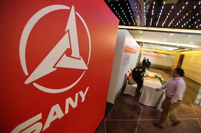 A man walks past a logo of Sany Group during a news conference in Beijing, October 18, 2012. REUTERS/Jason Lee