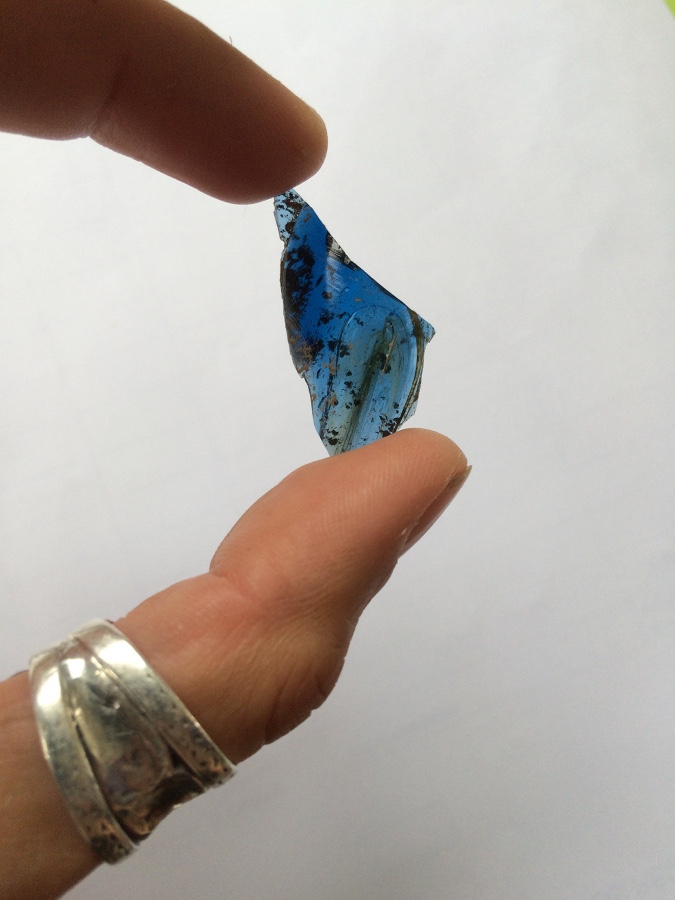 Beautiful fragment of blue glass that may have come from a claw beaker, found in the Timber Hall trench