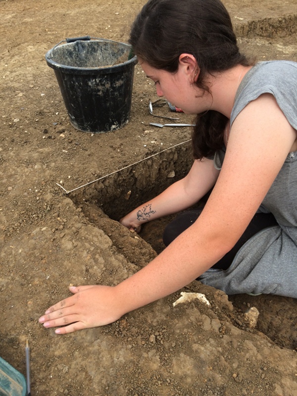 Emma excavates a post hole in one of the quadrants of the sunken-featured building - the 8th SFB we have excavated at Lyminge!