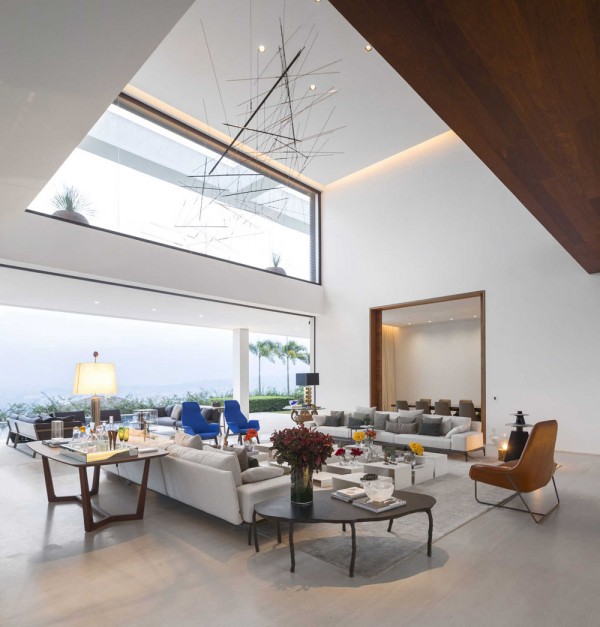 When coupled with soaring ceilings, the furniture topography (as the designer artfully calls it) makes the space feel even larger, more open, and full of imagination. The living area, in particular, has its ceiling doubled with height.