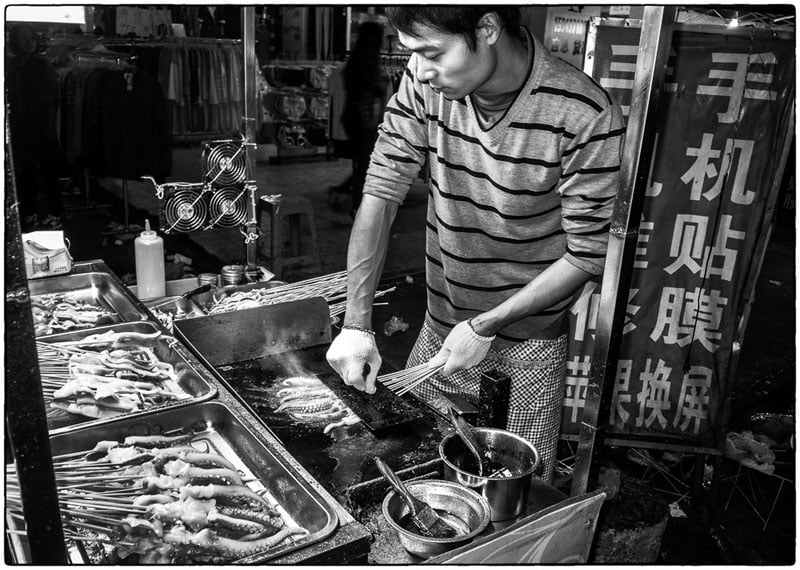 Squid man at the night market – Qingxi, China