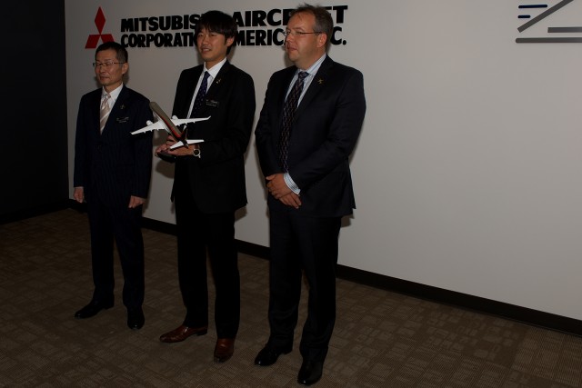 Mitsubishi and Aerotec executives pose with a model MRJ90 - Photo: Bernie Leighton|AIrlineReporter