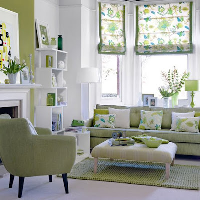 white walls, green accent wall, green sofa, leaf roman shades