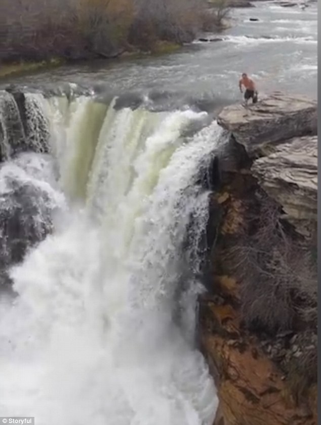 Chris Mezai makes his running start ahead of his daredevil plunge down a 40ft waterfall