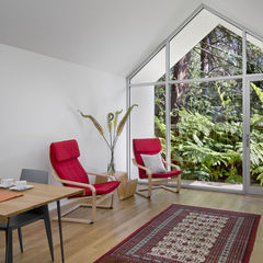 Red POÄNG chairs from IKEA in Berkeley cottage by Turnbull Griffin Haesloop.