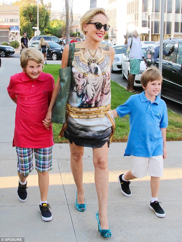 Out with her boys: The actress, pictured with adopted sons Laird, 10 and Quinn, nine, in September, hired ZCC for a $225,000 remodel of her master bedroom, master bathroom, kitchen and powder room in 2013