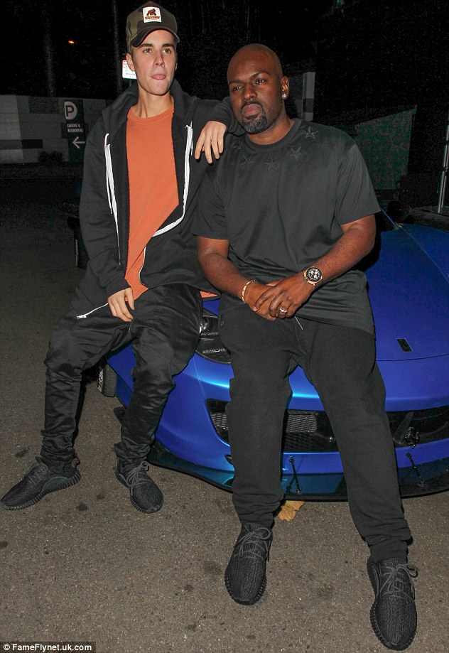 Toyboys united: Justin posed up on his hideously customised Ferrari with Kris Jenner's lover Corey Gamble