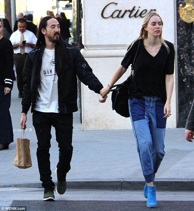 Tied the knot: DJ Steve Aoki, 38, and Australian model Tiernan Cowling, 24, pictured in Beverly Hills in November, married in Hawaii on Friday