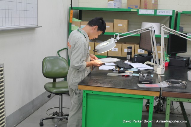 Engine parts being inspected by one of the EGAT workers