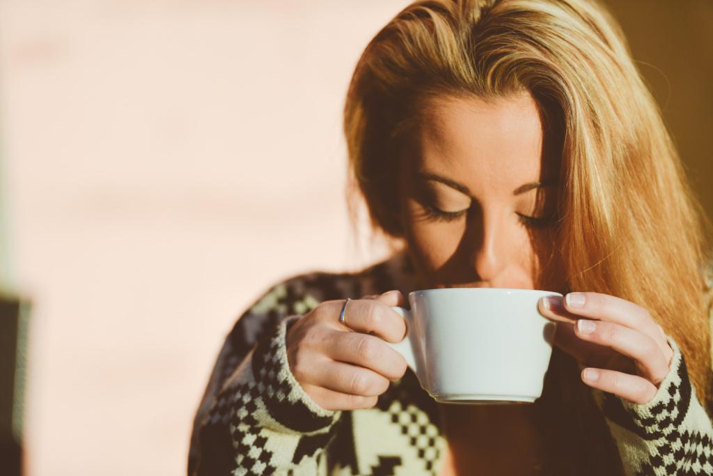 Blond Girl Peacefully Drinking Coffee At Sunrise_