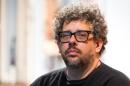 FILE - In this May 1, 2015 photo, Neil LaBute poses on the set of his new play "The Way We Get By" at the Second Stage Theatre in New York. A play festival benefiting the National Coalition Against Censorship will go on at a new location, but without the Neil LaBute play that led to the event being scrapped at its initial venue. Playwrights for a Cause said Tuesday that its festival featuring three new short plays about censorship in the arts will take place on June 14 at New York Theatre Workshop. (Photo by Charles Sykes/Invision/AP, File)