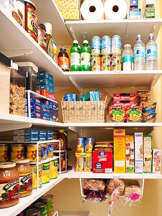 Using as much empty space as possible in the pantry by placing under-shelf racks.