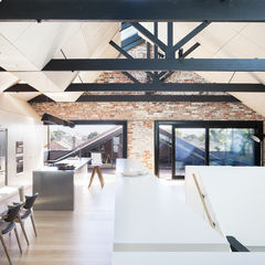 Renovated warehouse with exposed structure and ample skylights.