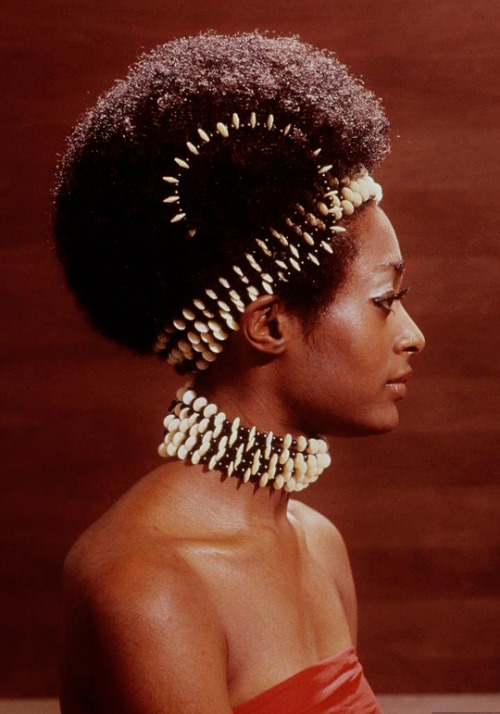 Roanne Nesbitt modeling Afro wig & African-inspired necklace...
