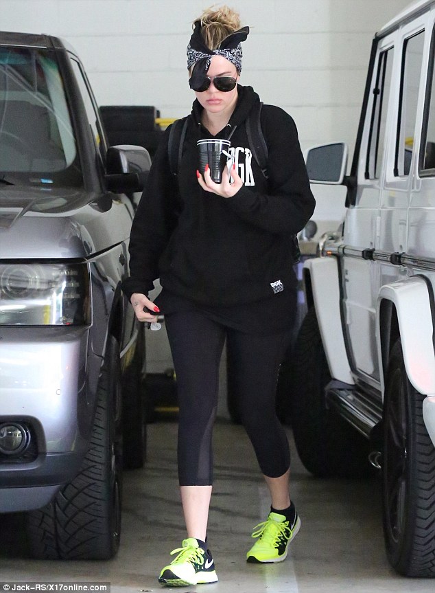 Somber: Khloe Kardashian looked downcast as she arrived at the gym in Los Angeles on Tuesday morning 