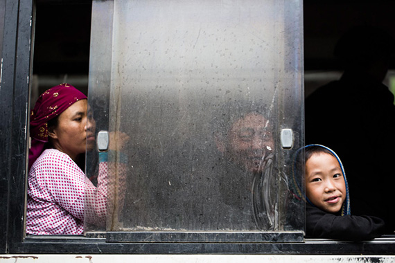  A Hmong boy sitting on a bus in Vietnam