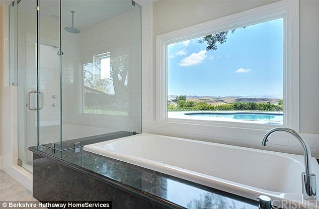 A bath with a view: Self-styled Lord Disick will surely enjoy soaking in this huge tub with large window beside it