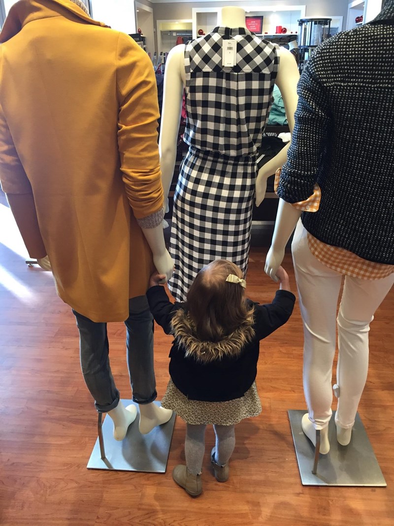 funny parenting image little girl befriends mannequins