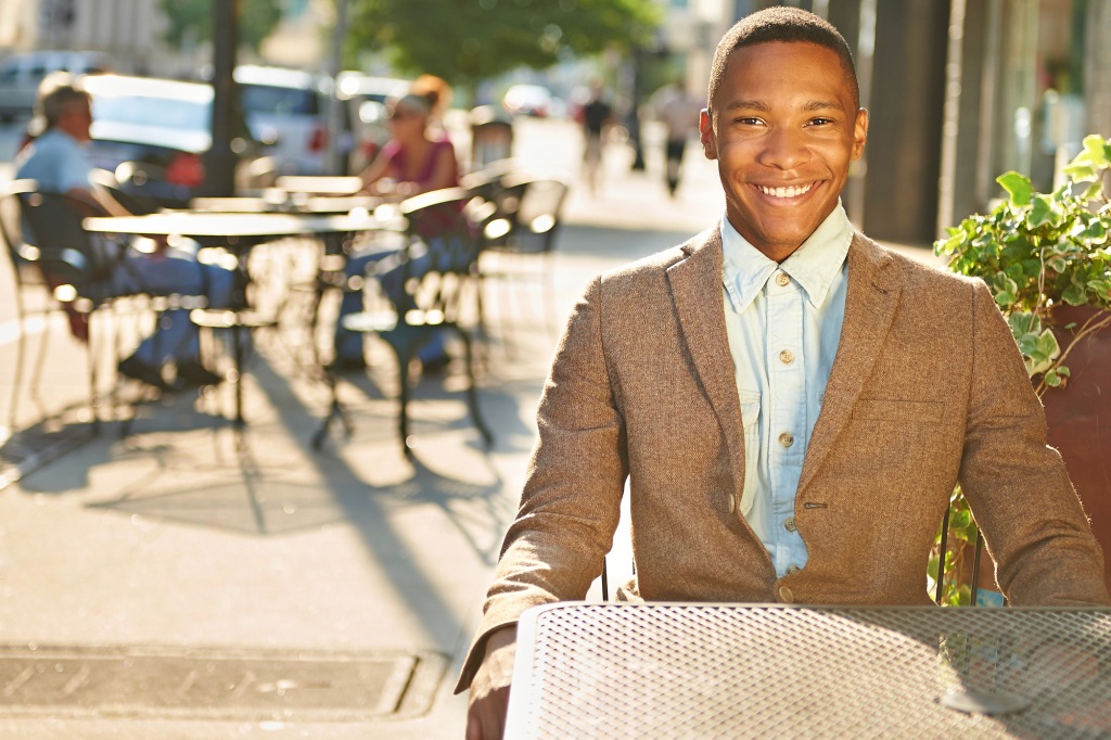 Young relaxed successful African - American business man in the city