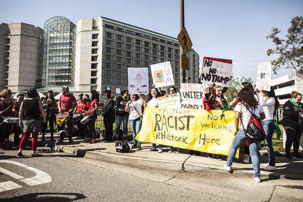Hundreds gathered on Friday outside a hotel in Burlingame, near San Francisco, that was playing host to the state's Republican Party Convention, armed with signs that labelled Trump a racist and fascist.