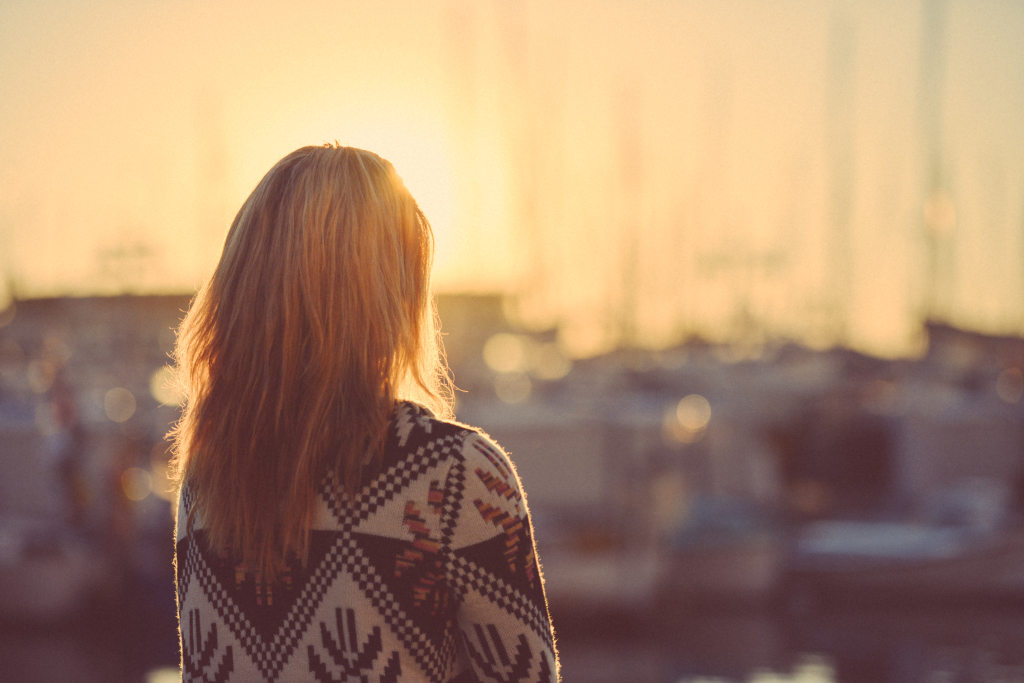 Blond Girl Thoughfully Watching A Sunrise