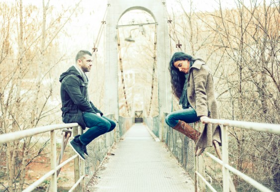 Couple Talking on Bridge