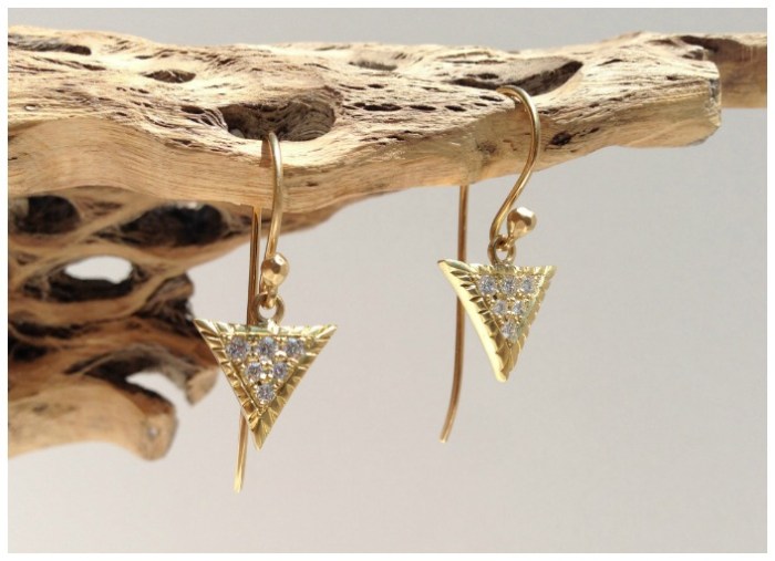 The large pave Scale earrings in gold with diamonds. From Lisa Kim's newest jewelry collection, The Seabeast.