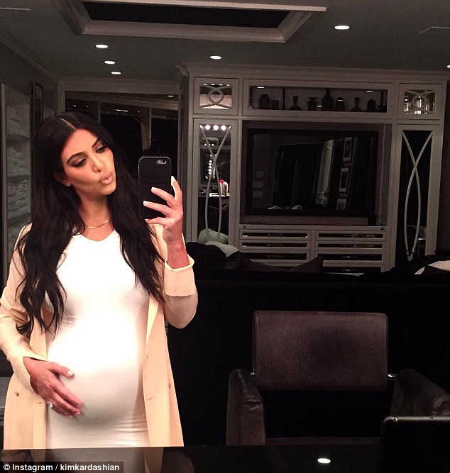 Bumping along: During her pregnancy, Kim proudly showed off her growing bump with plenty of selfies, but now she is set on losing around another 40lb