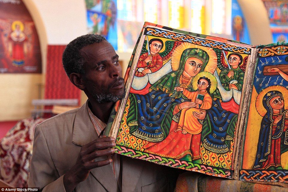 Colour artwork on display inside a Tigray region cathedral in Ethiopia. The landlocked country is twice the size of Spain with a population of 95 million
