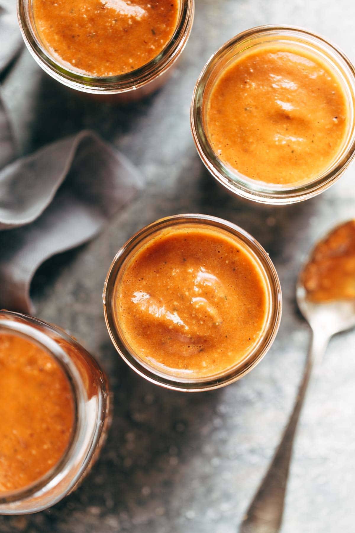 Romesco Sauce! ready in 5 minutes and perfect for serving with grilled chicken, vegetables, crispy potatoes, eggs, and more. Made with roasted red peppers, tomatoes, olive oil, garlic, salt, parsley. vegan / vegetarian. | pinchofyum.com 