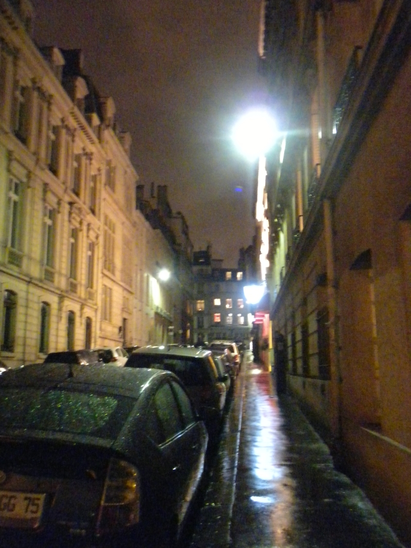 rue keppler in the rain at night
