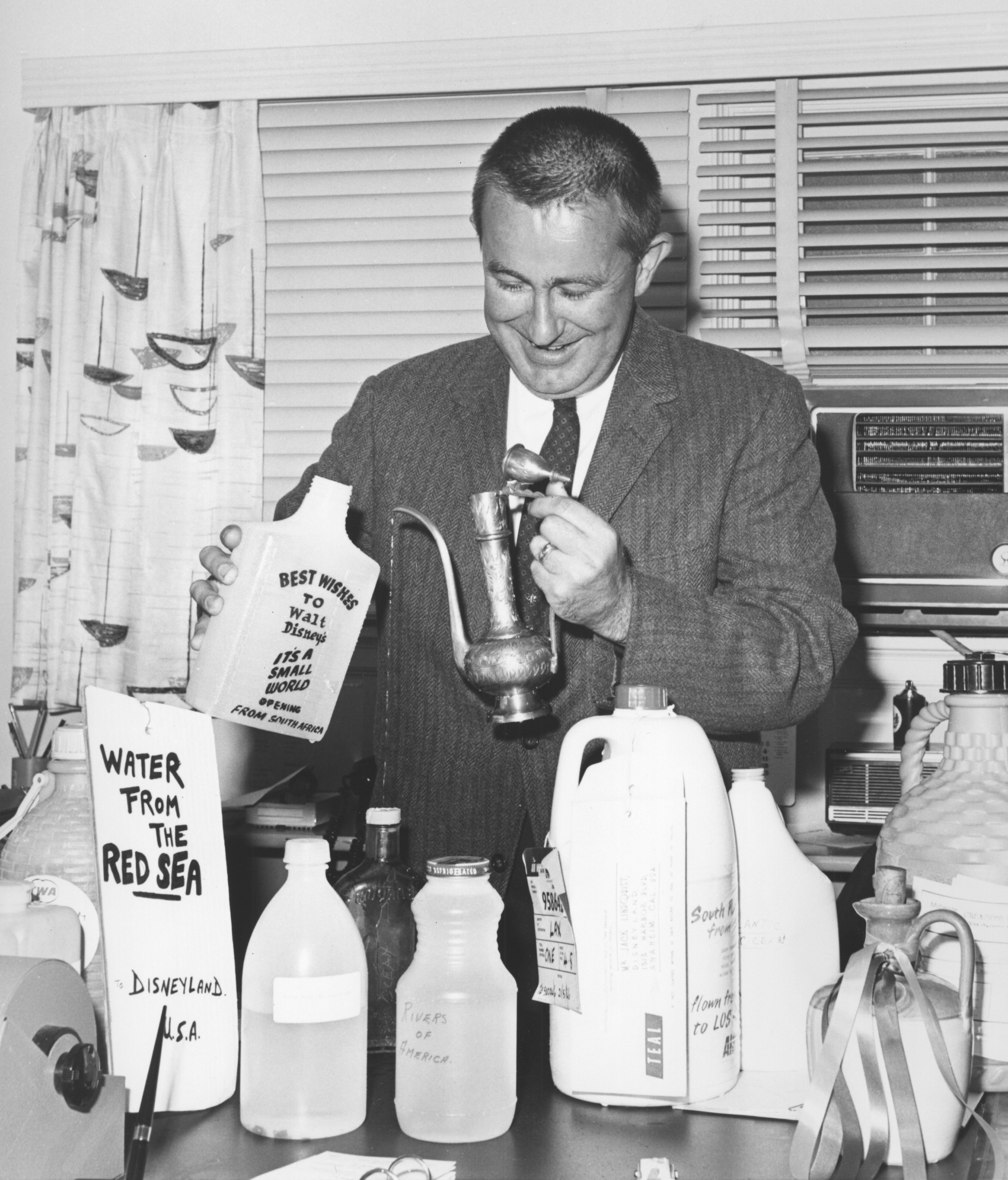  Caption: Jack Lindquist prepares water gathered around the world for the opening of 'it's a small world' at Disneyland in 1966.