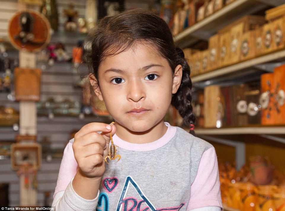 Brave: Scorpion manicure fan Lupita Garcia's daughter Ana Carol is much like her mum in that she is not scared of the insects, even though they can kill an adult with just a single sting