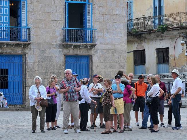 Tourists check out the sites in Old Havana. Picture: Yamil Lage/AFP/Getty Images