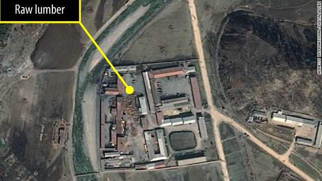 One of four satellite images taken of a probable furniture factory. Lumber piles changed over time, indicating production activity.