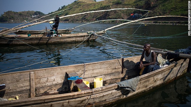 A fisherman sits in a boat on the shore of Lake Kivu in Goma in August. "There are no big fish because of the gas; we only catch small whitebait," one said of the carbon dioxide and methane that saturate the lake.