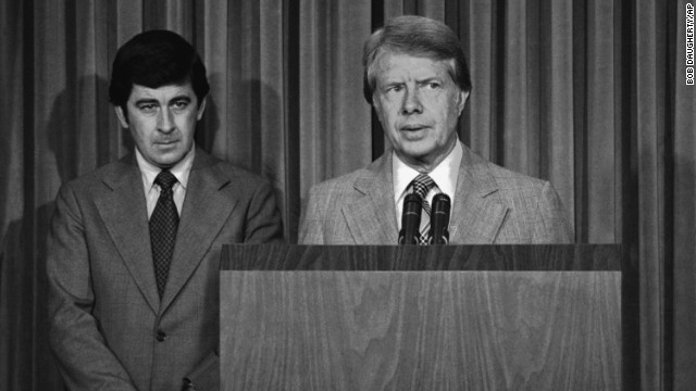 President Jimmy Carter, with his special assistant for health issues, Dr. Peter Bourne, beside him, talks to reporters at the White House about his drug abuse control message to Congress on August 2, 1977. Among other things, he called for the elimination of all federal criminal penalties for the possession of up to one ounce of marijuana.