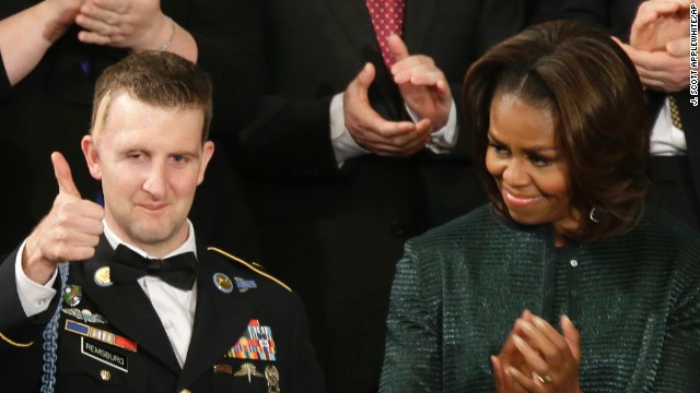 Army Sgt.1st Class Cory Remsburg, who was wounded in Afghanistan and awarded the Bronze Star and the Purple Heart, acknowledges thunderous applause for him at U.S. Capitol during President Barack Obama's State of the Union address. 