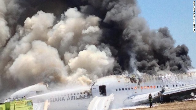 A photo provided to CNN by Eunice Bird Rah -- and shot by her father, who was a passenger on the plane -- shows flames and smoke bursting out of many of the aircraft's windows.