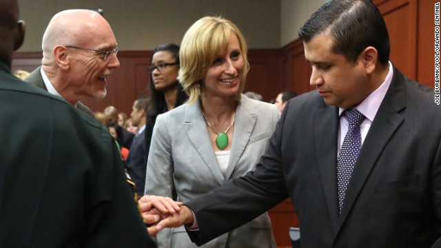 George Zimmerman is congratulated by members of his defense team, Don West and Lorna Truett, after the not guilty verdict is read on Saturday, July 13, in Sanford, Florida. A jury of six women found him not guilty in the shooting death of Trayvon Martin. View photos of the public reaction to the verdict.