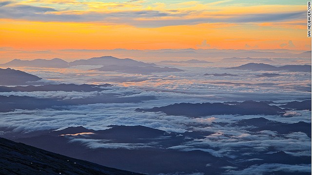 The sun rising over Sabah as seen from the summit at Low's Peak, named after former British Colonial Administrator Hugh Low, who made the first documented ascent of Mount Kinabalu's summit plateau in 1851.