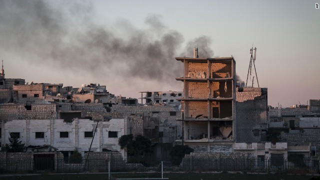Smoke rises after a mortar shell hit a residential area during fighting between Syrian government forces and rebels in Maaret al-Numan, Syria, on October, 9.