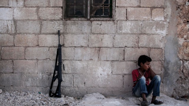 A Syrian child sits in a village in the Idlib province countryside on Septeptember 19. 