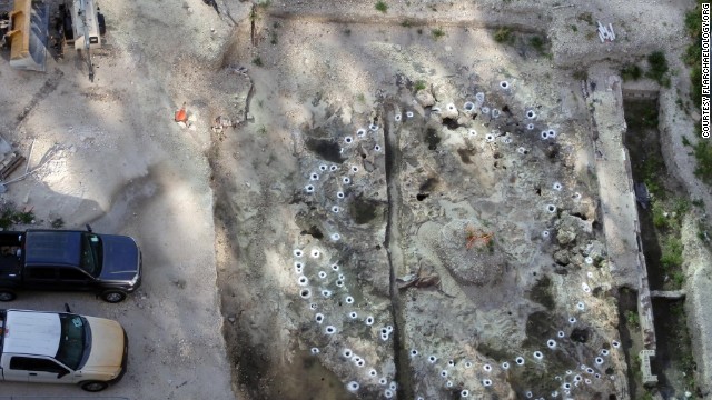 A network of holes lay out the foundations of a Tequesta settlement. The ancient tribe lived in what is now metro Miami until the 1700s, and the holes held pine posts that framed their thatched buildings.