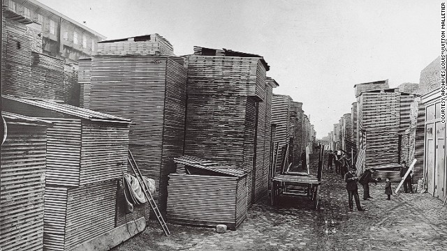 The town of Asnières was chosen as the location of Louis Vuitton's workshop because of its convenient transport links - it sits along the Seine, and is connected to Paris by rail. Here, a 1903 photo shows poplar boards used for manufacturing of trunks unloaded from a barge. 