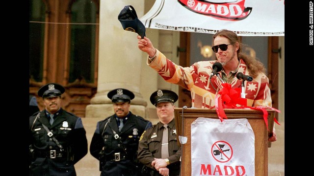 Nugent salutes a crowd in Lansing, Michigan, during a sober driving event sponsored by Mothers Against Drunk Driving in 1999.
