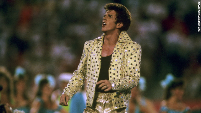 In 1989, Elvis Presley impersonator Elvis Presto took to the Super Bowl stage in head-to-toe gold lame to perform "the world's largest card trick" among a bevy of Solid Gold dancers.