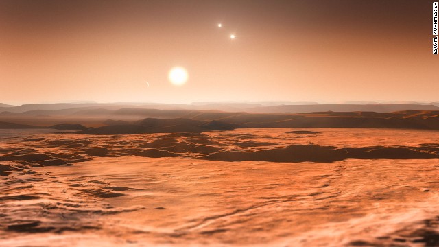 Scientists announced in June 2013 that three planets orbiting star Gliese 667C could be habitable. This is an artist's impression of the view from one of those planets, looking toward the parent star in the center. The other two stars in the system are visible to the right.