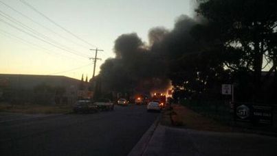 Thick, plumes of smoke from the factory fire in Melbourne's north blankets the city. (Twitter user @MickArena)
