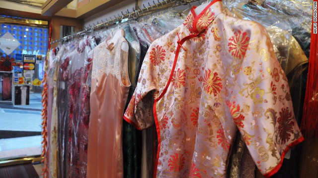 At Hong Kong cheongsam shops, customers choose a style off the rack before deciding on details such as flower buttons on the placket, sleeve length and slit depth. 